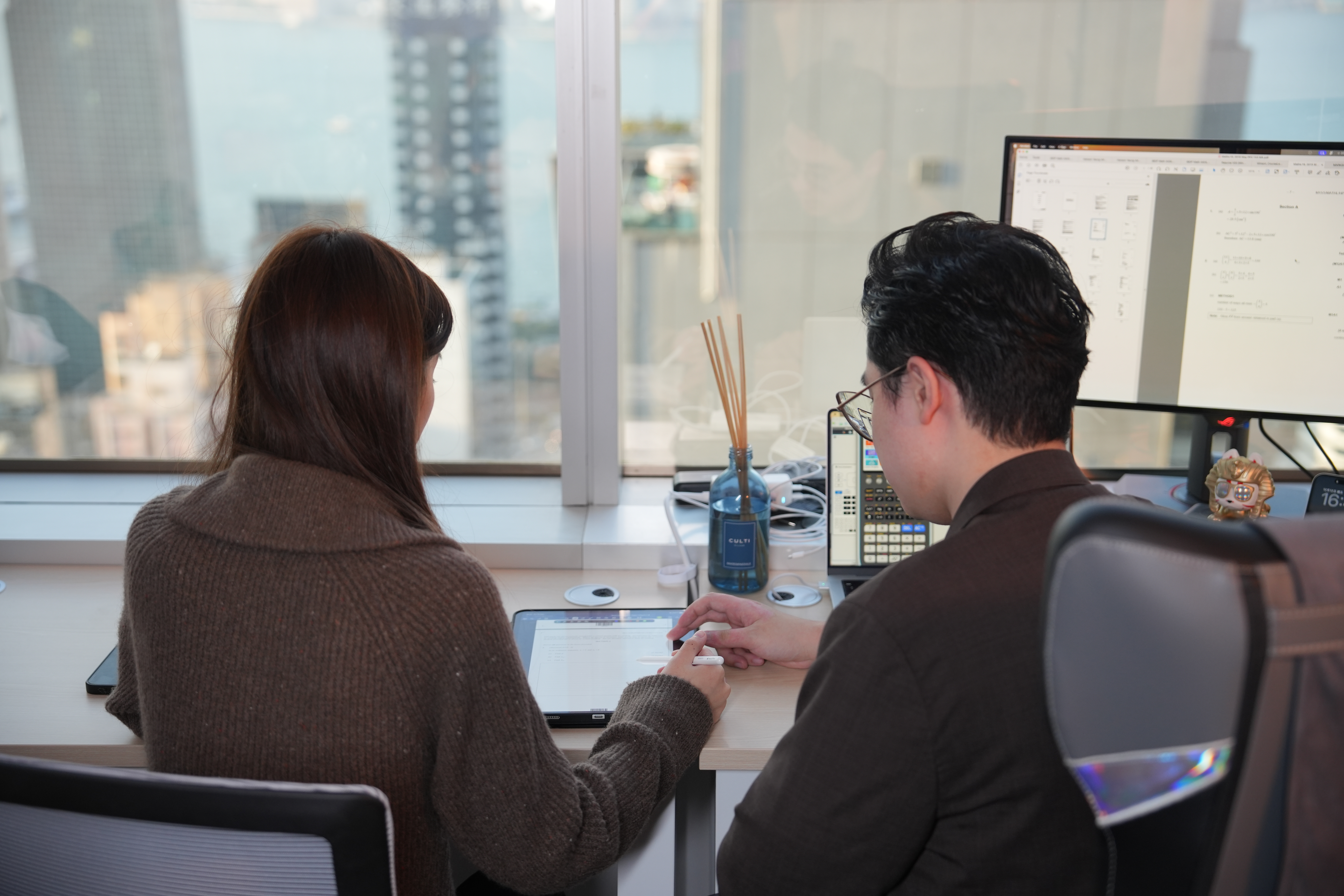 Tutor pointing upward